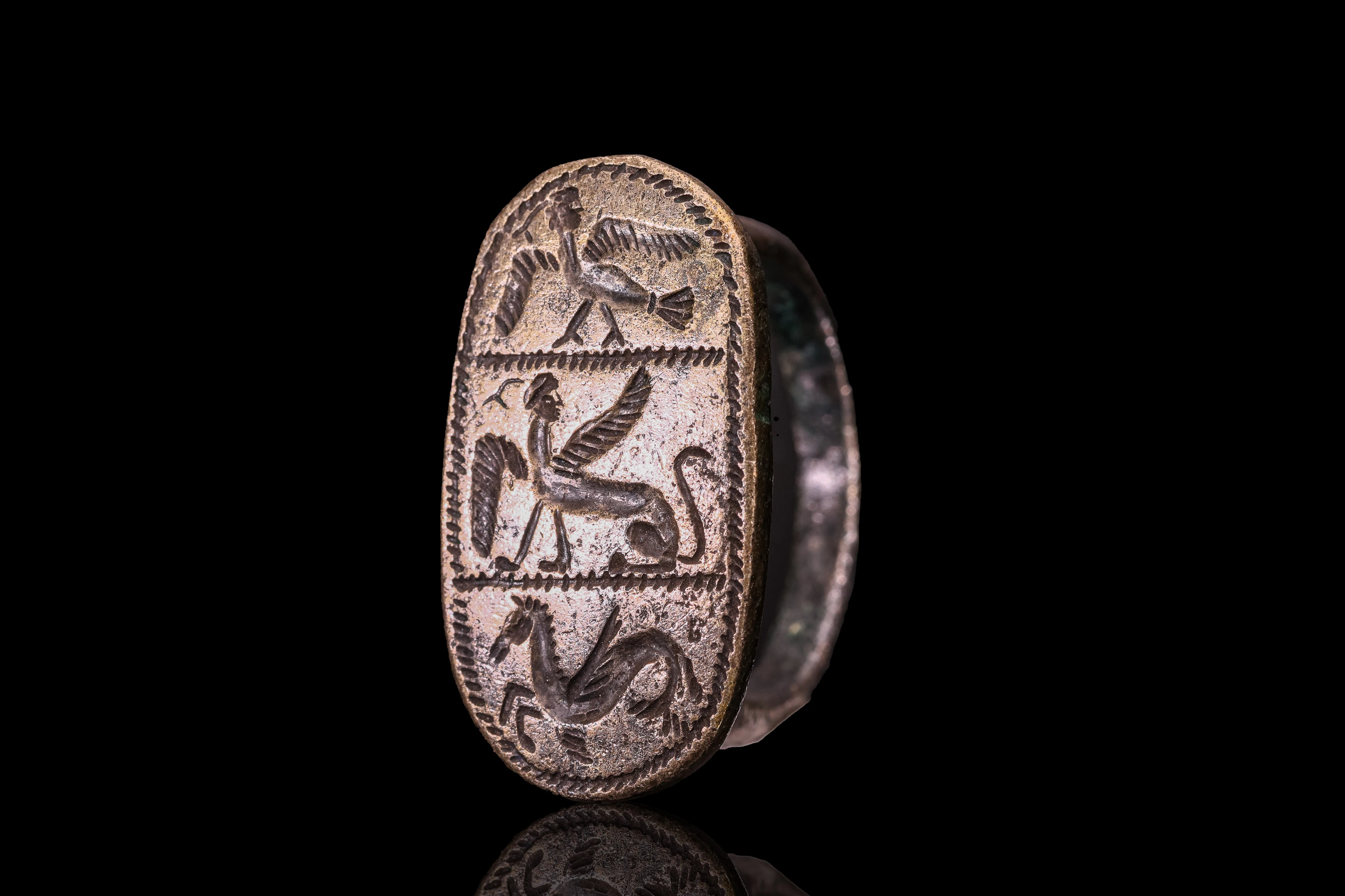 GRAECO - ETRUSCAN SILVER RING WITH MYTHOLOGICAL ANIMALS