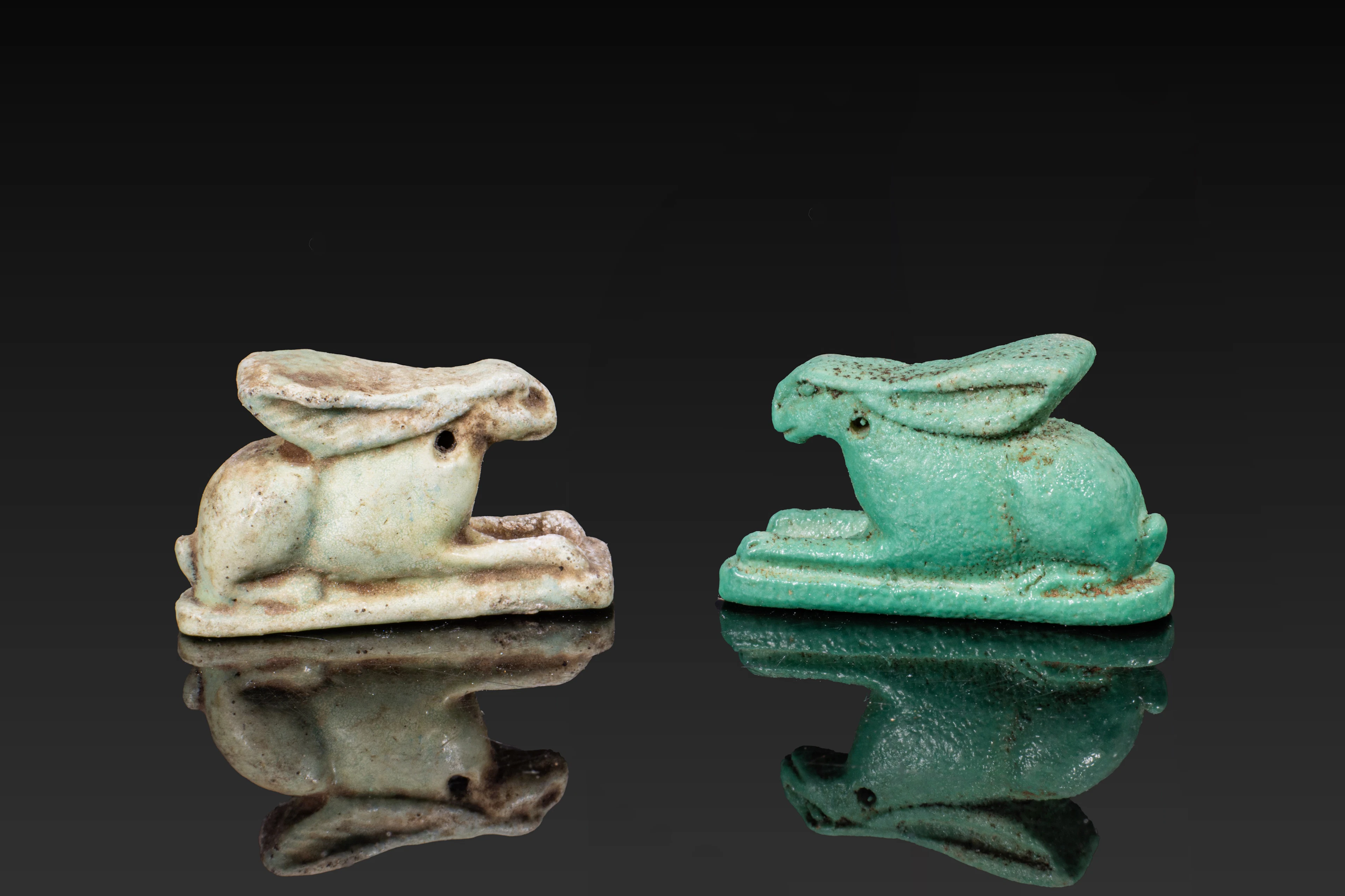 PAIR OF EGYPTIAN FAIENCE HARE AMULETS