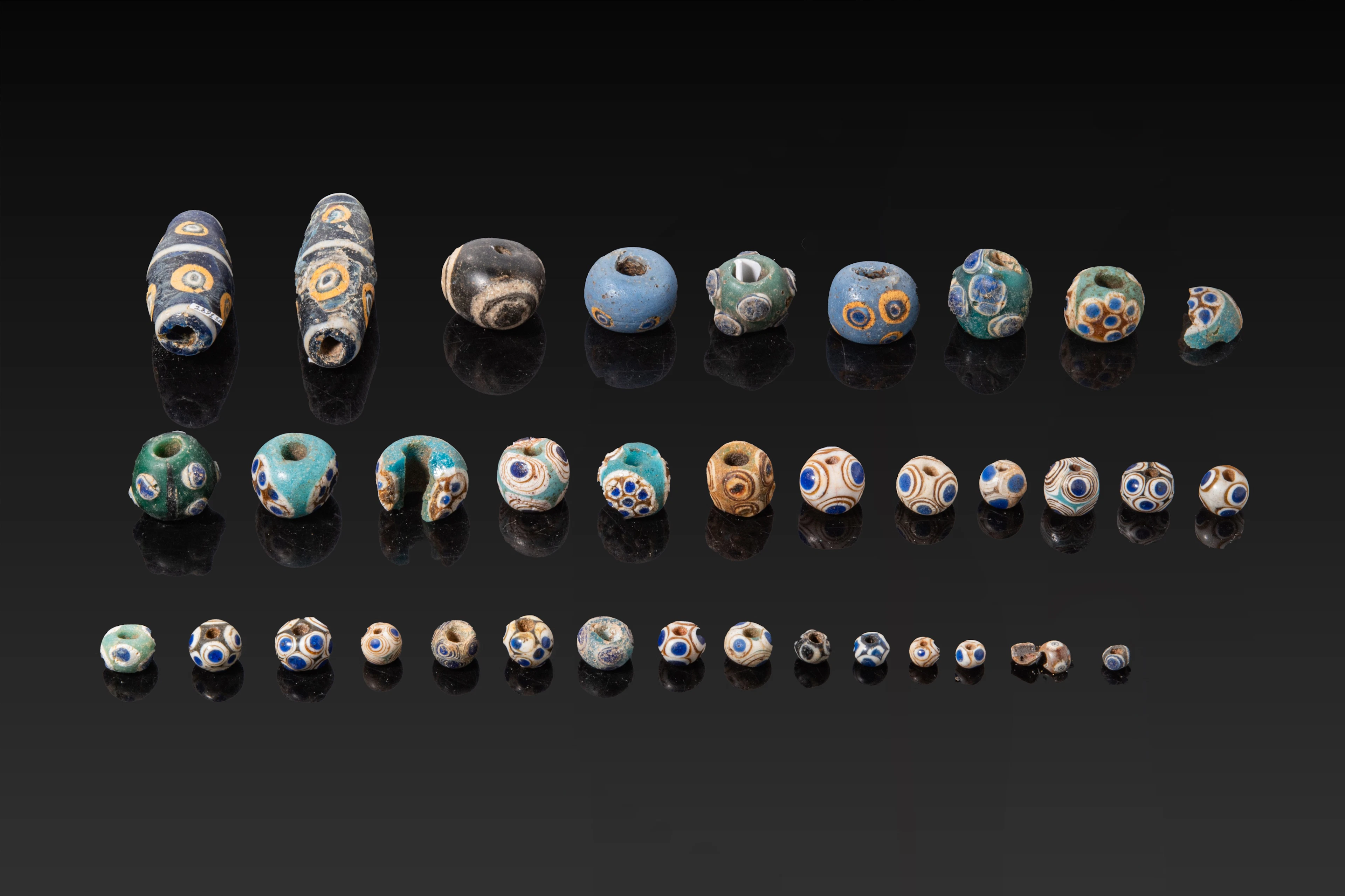 COLLECTION OF PHOENICIAN GLASS EYE BEADS