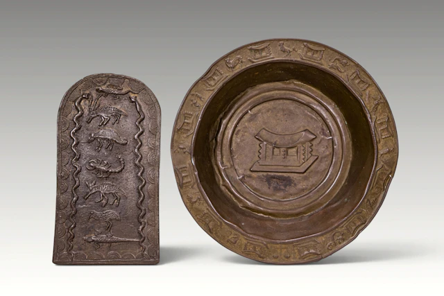 AKAN BRONZE ZODIAC PLATE AND ZOOMORPHIC PLAQUE