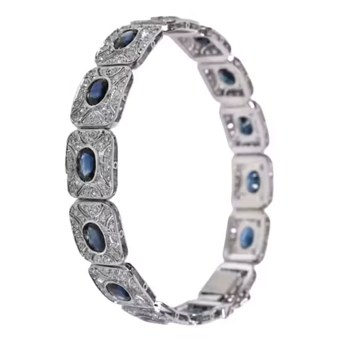 ARMBÅND i hvitt 14 karat gull bestående av 14 ledd