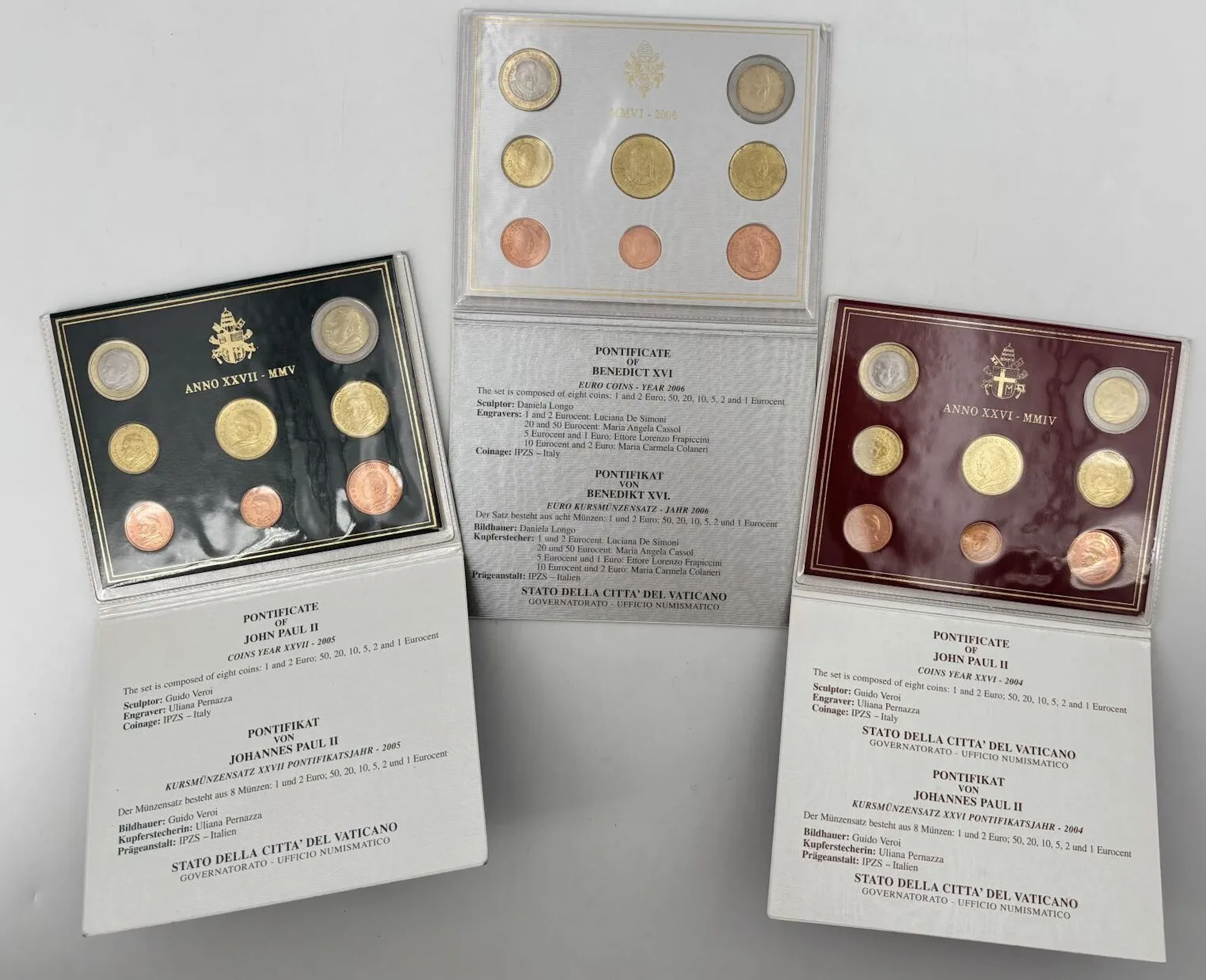 Three sets of collectible euro coins, including: - Lot 70