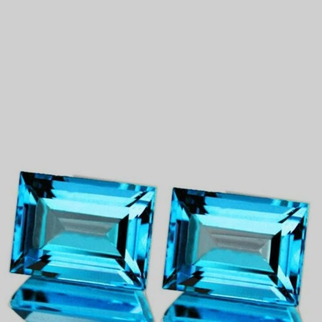 NATURAL BABY SWISS BLUE TOPAZ PAIR 12x9 MM [IF-VVS
