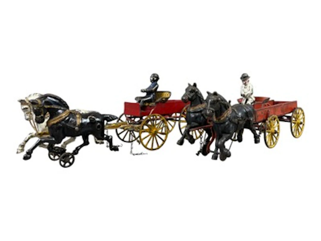 (2) Cast Iron Horse Drawn Wagons