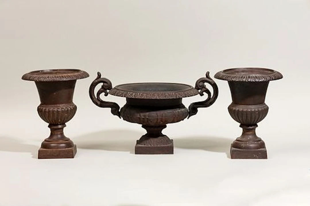 Neoclassical style cast iron garniture de cheminee with baluster vases