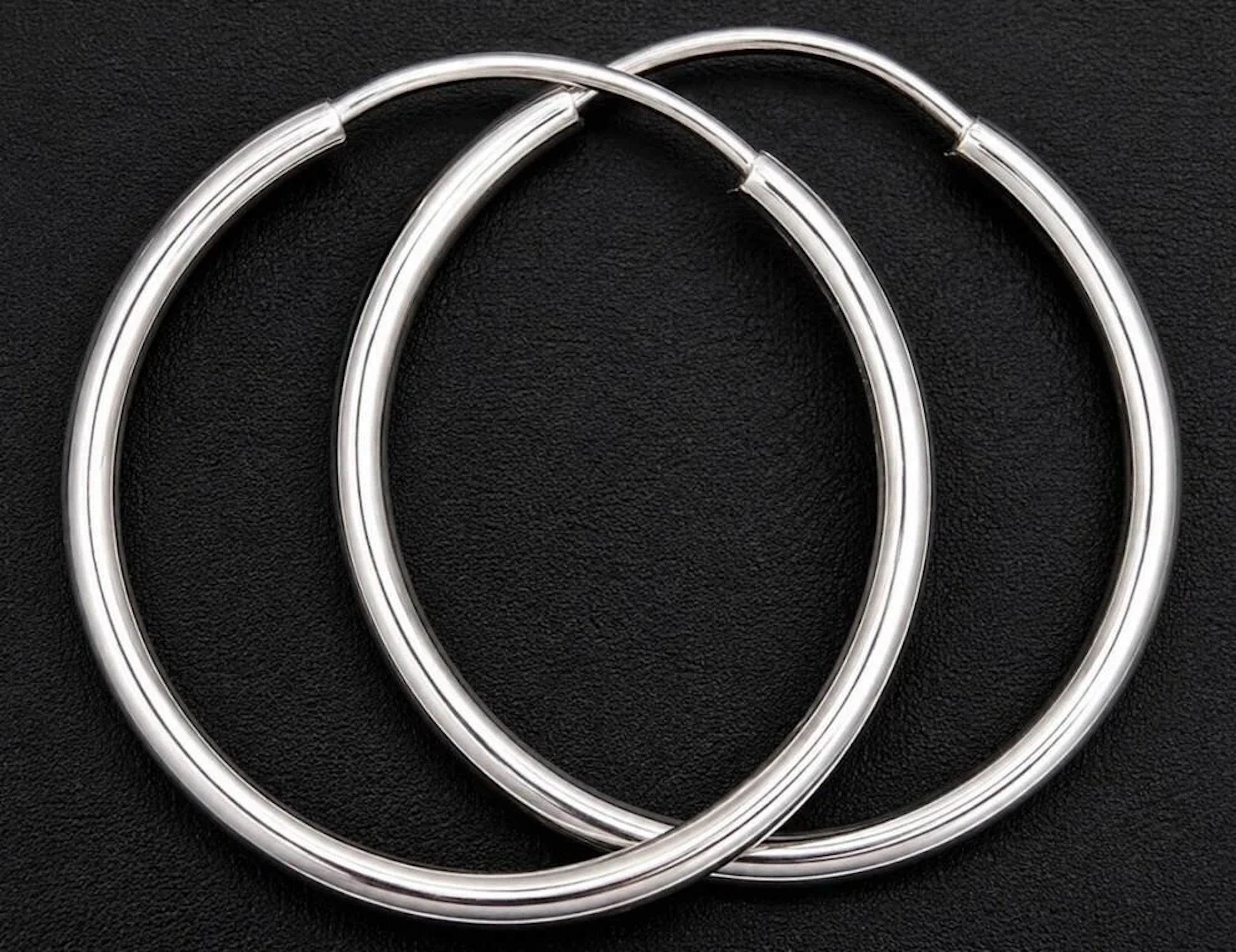 $800, 10k(1g), hoop earring, MSRP $800