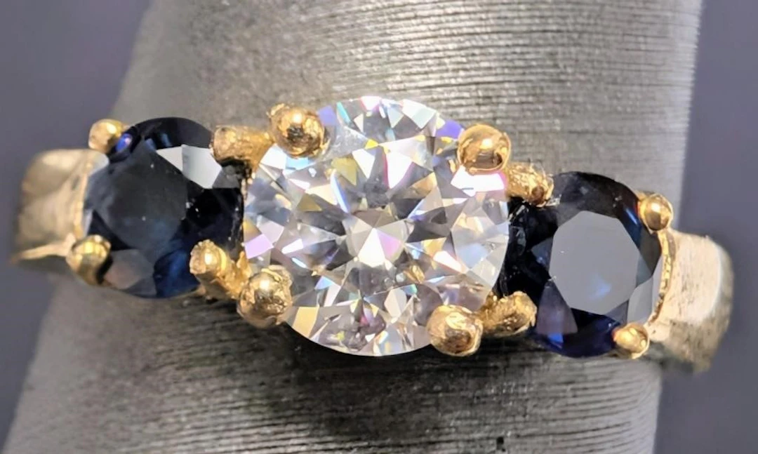 $1990, 10k(2.82g), moissanite (0.6ct), blue sapph