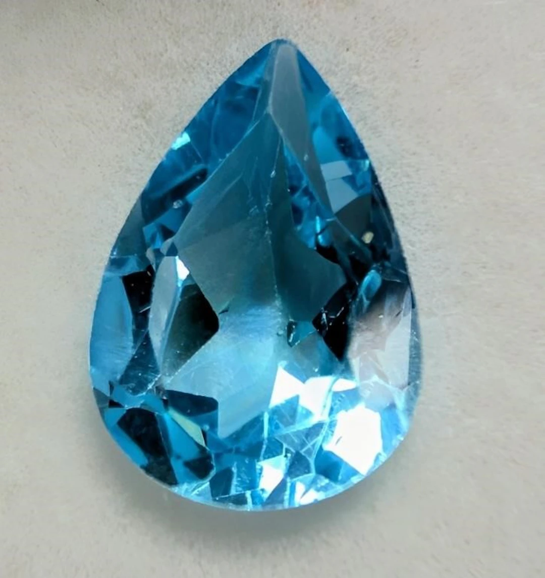 $100, blue topaz (app 2ct) gemstone, retail value