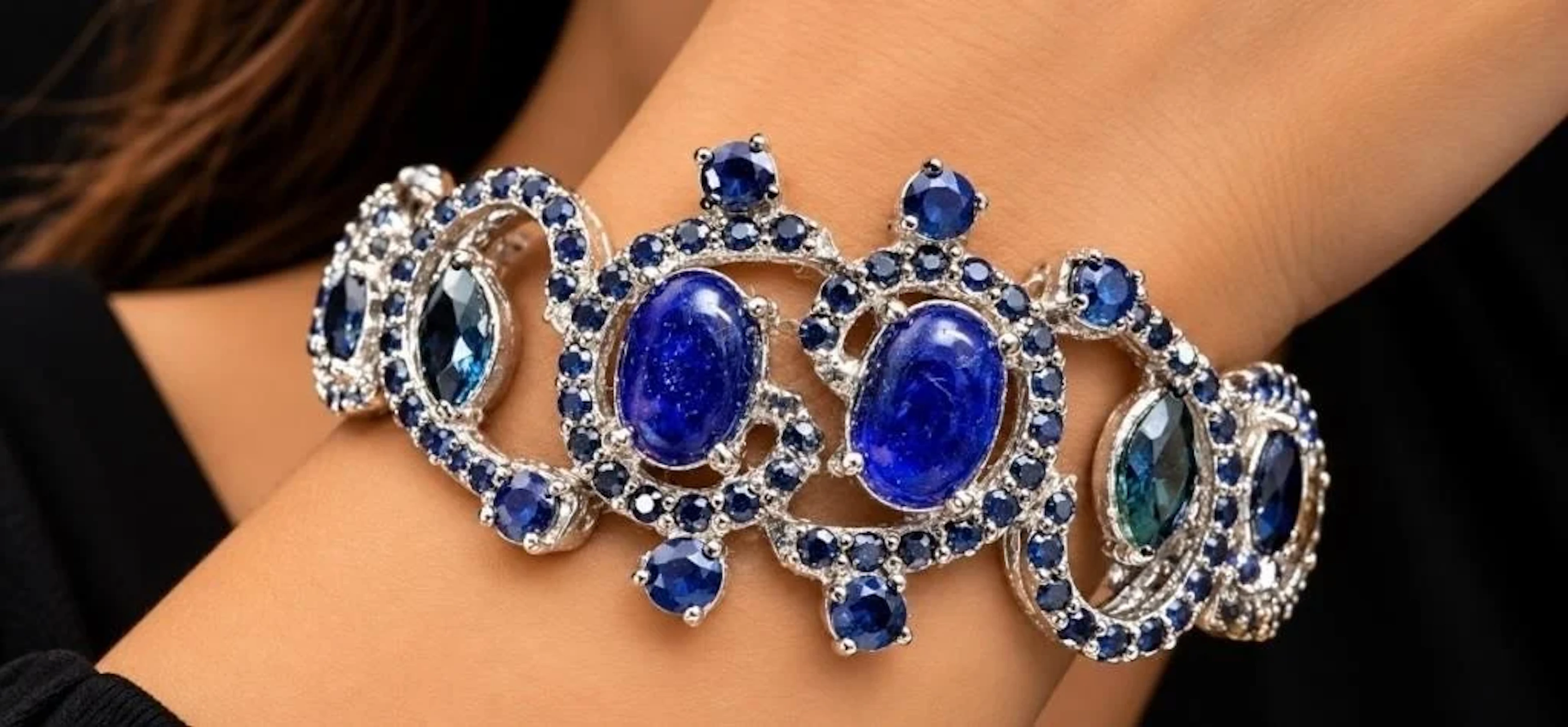 $2400, silver(30.7g), sapphire (12ct)bracelet 7"