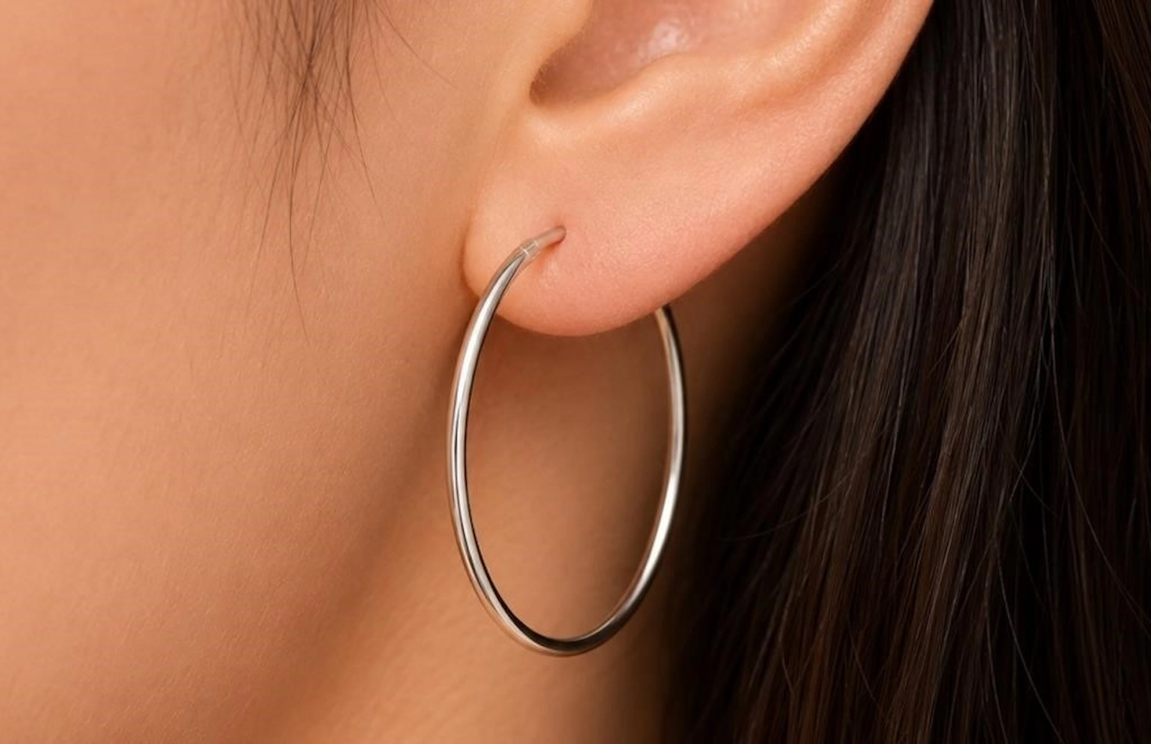 $50, silver(1.47g), hoop earring, retail value $5