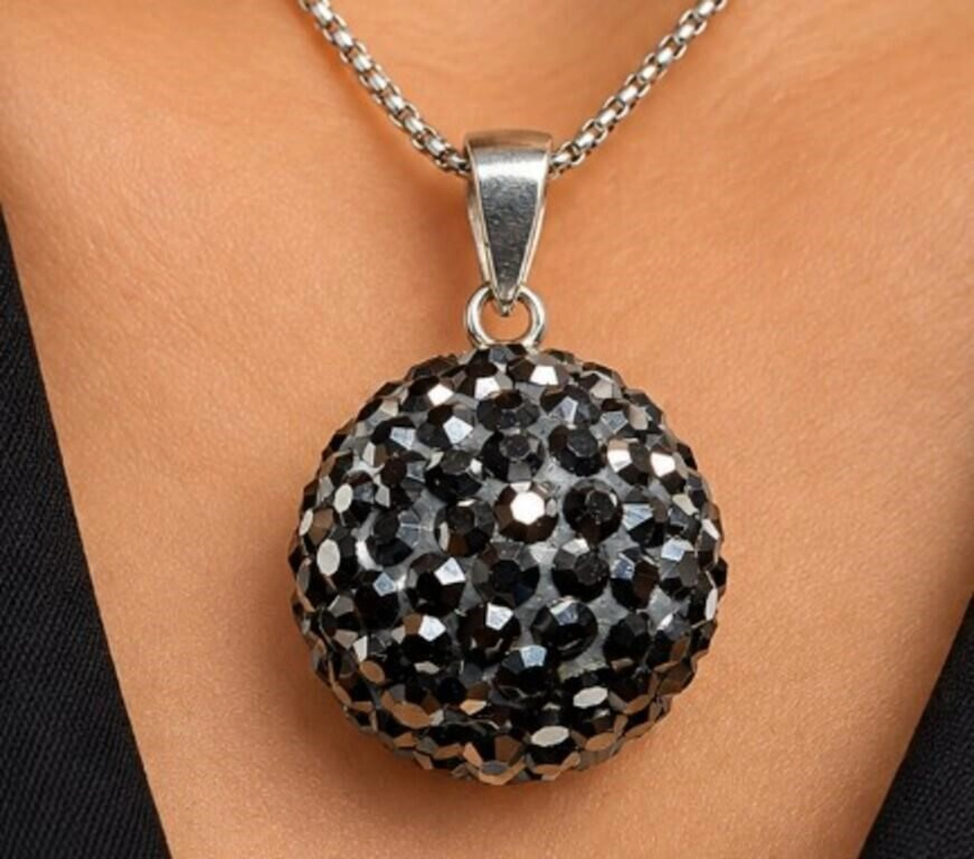 $60, silver(2g), black crystal pendant, retail val