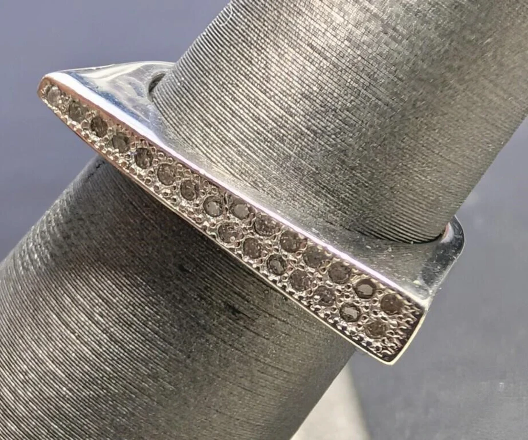 $80, silver(2.38g), cz ring, size , retail value $