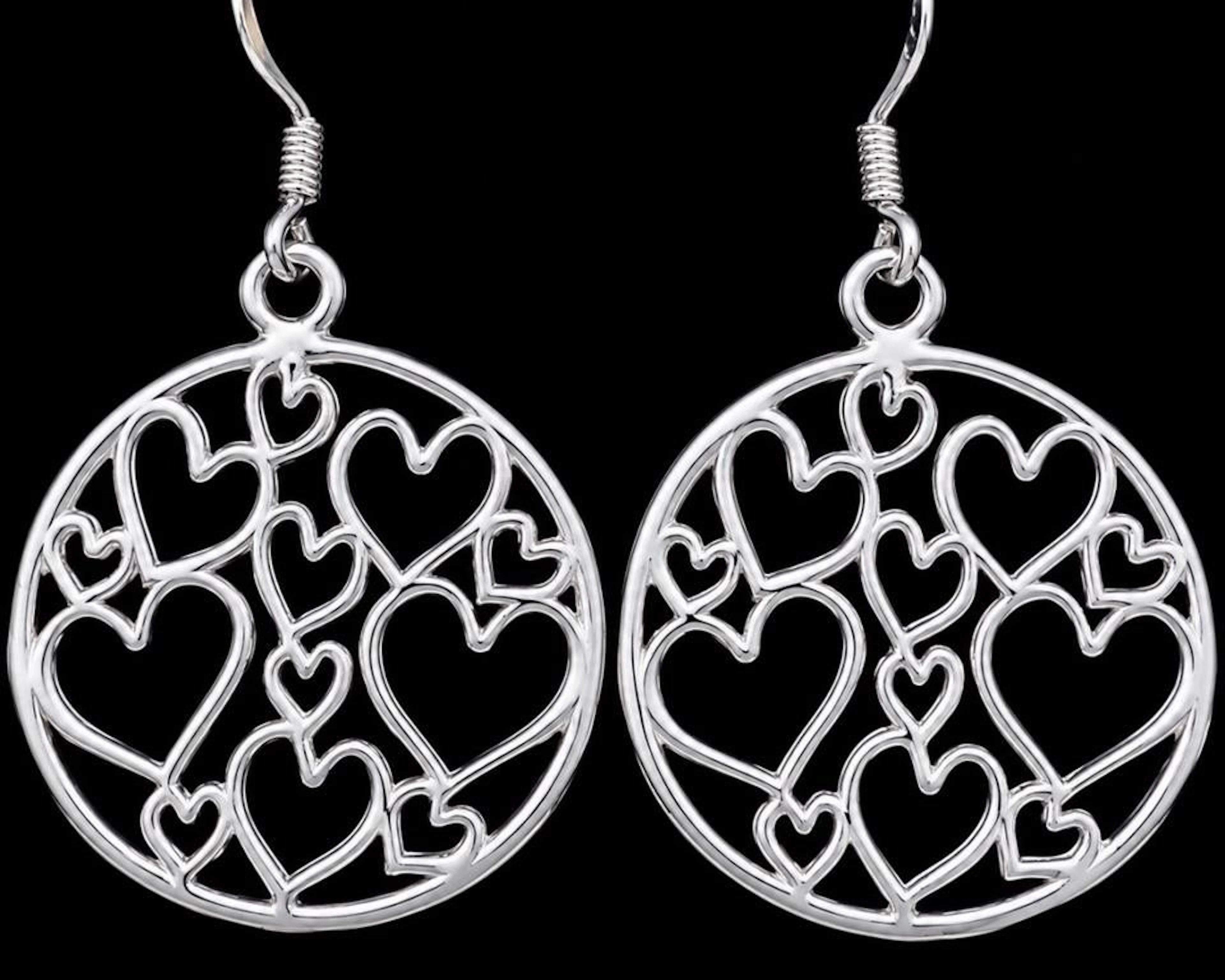 $140, silver(4.6g), heart earring, retail value