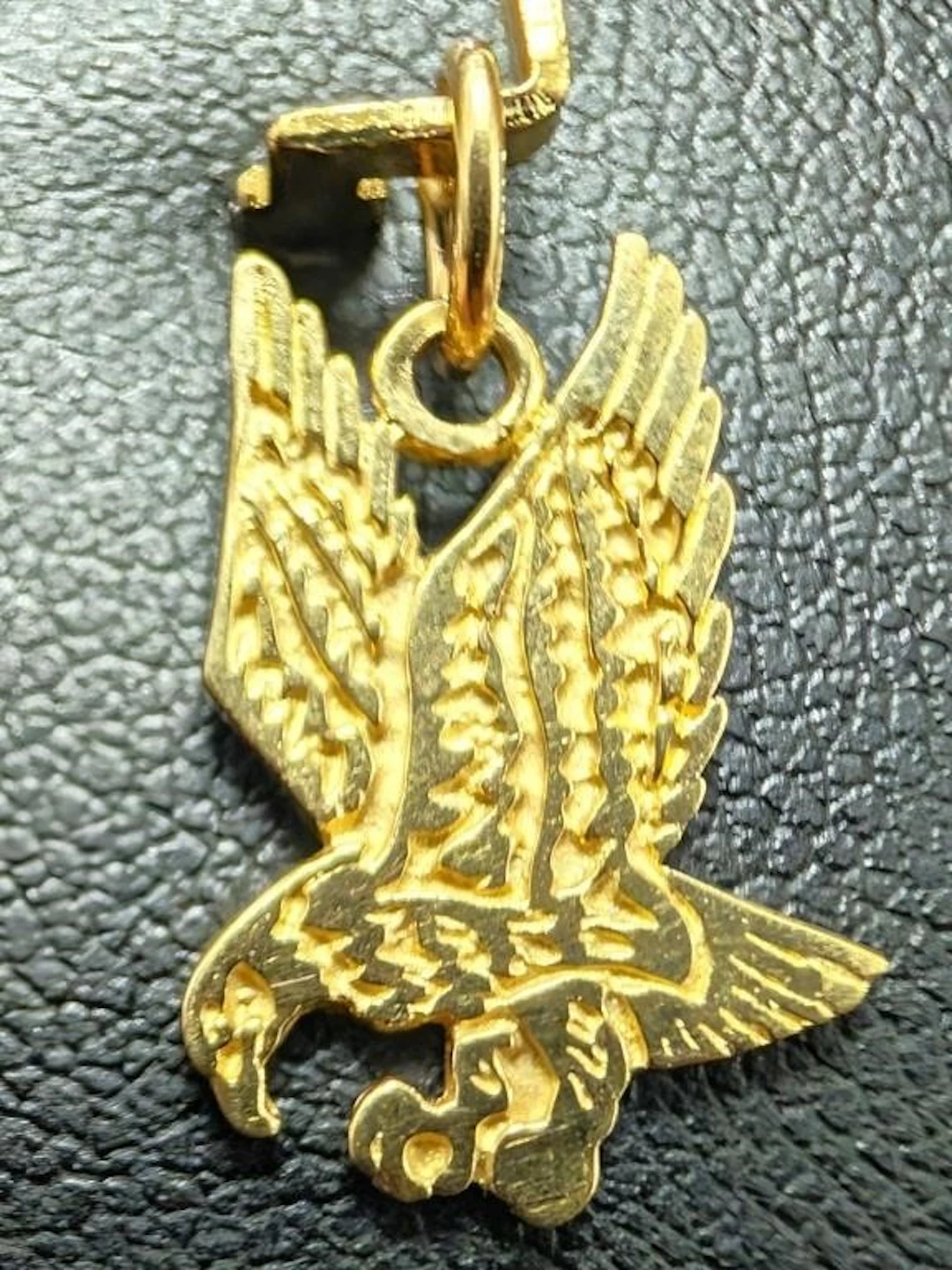 $680, 10k(0.95g), eagle pendant, retail value $68