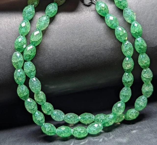 $2500, (33.7g), natural Emerald (165ct)necklace