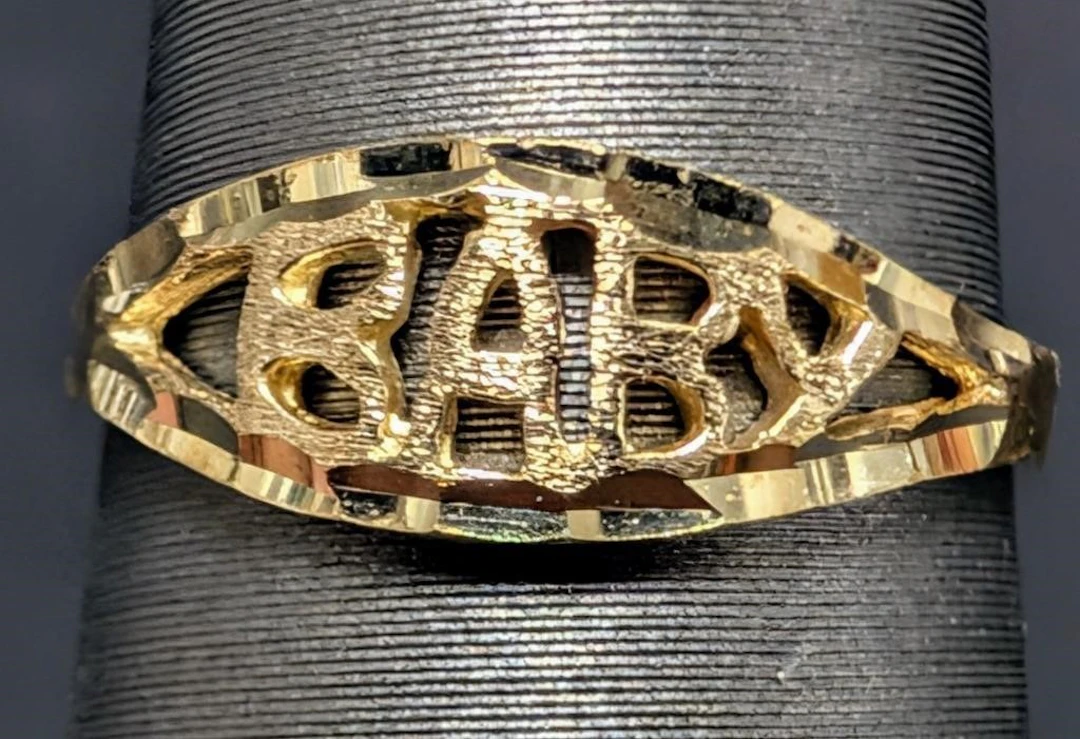 $500, 10k(0.74g), baby ring, retail value $500