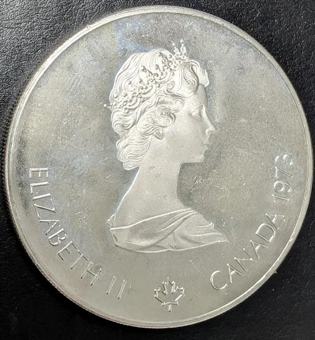 ., SILVER(24.42g), OLYMPIA $5 COIN, retail value .