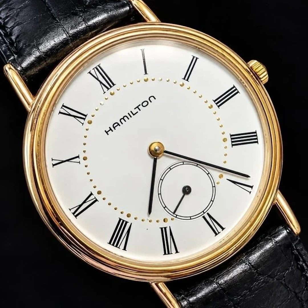 $595, Hamilton gold-tone slim dress watch with whi