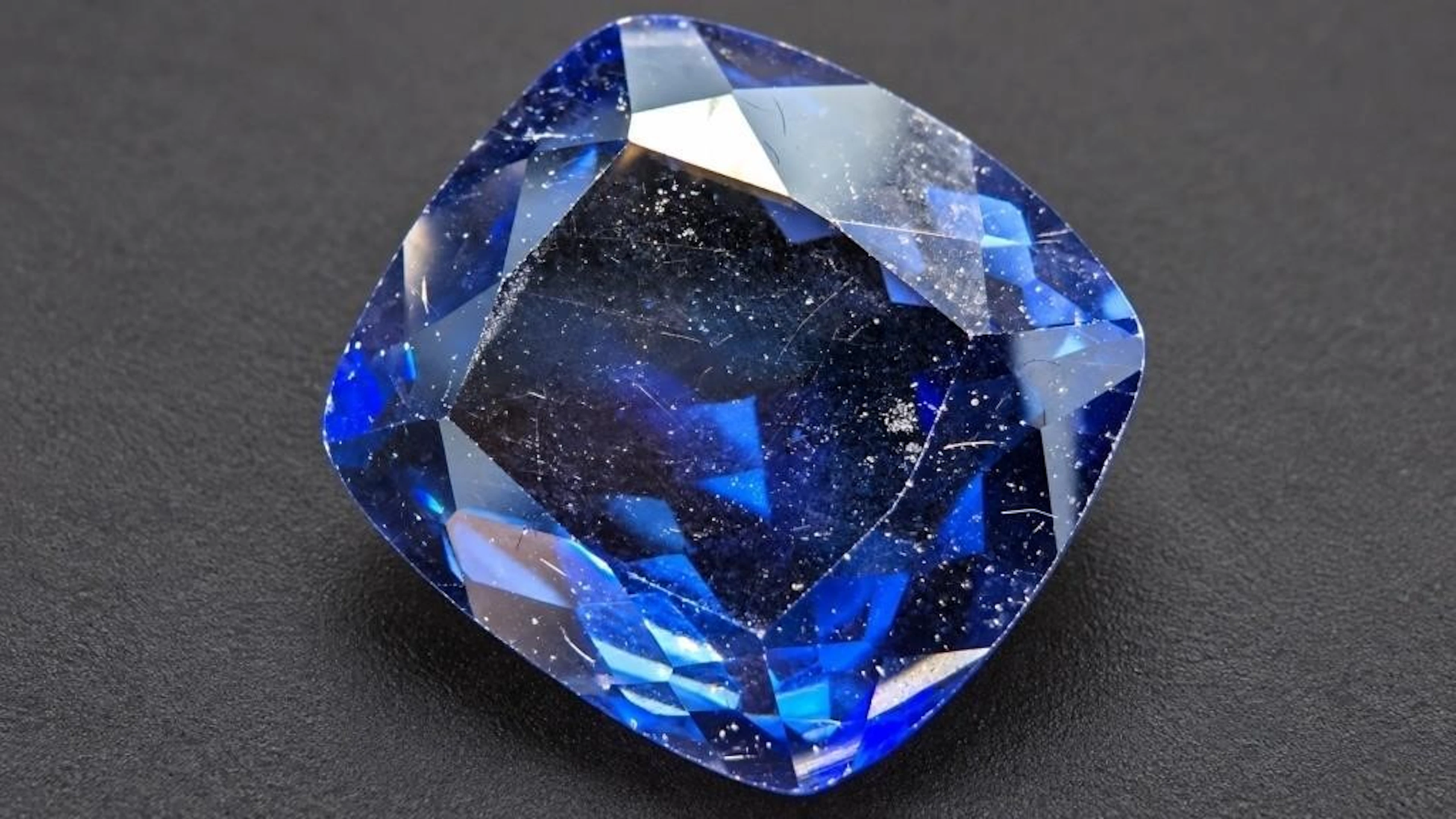 $900, Lab-created sapphire (7.6ct)gemstone, retail