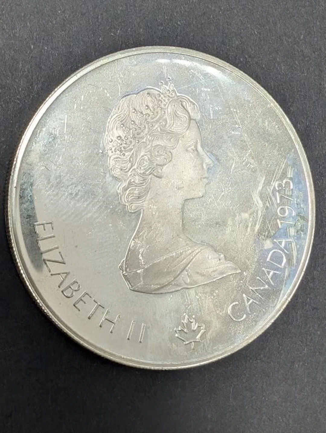 $240, silver(24.5g), $5 montreal olympiccoin, reta