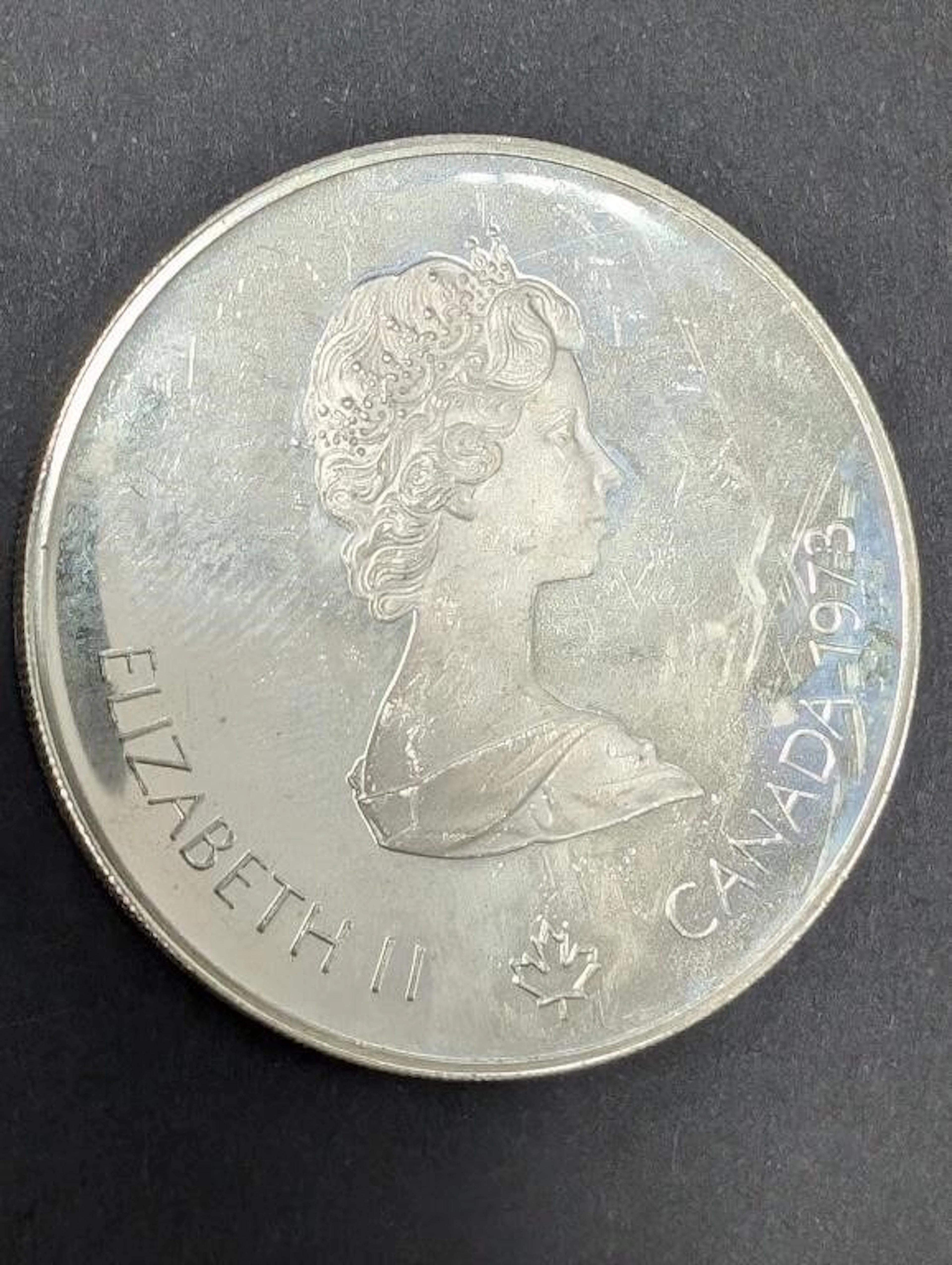 $240, silver(24.5g), $5 montreal olympiccoin, reta