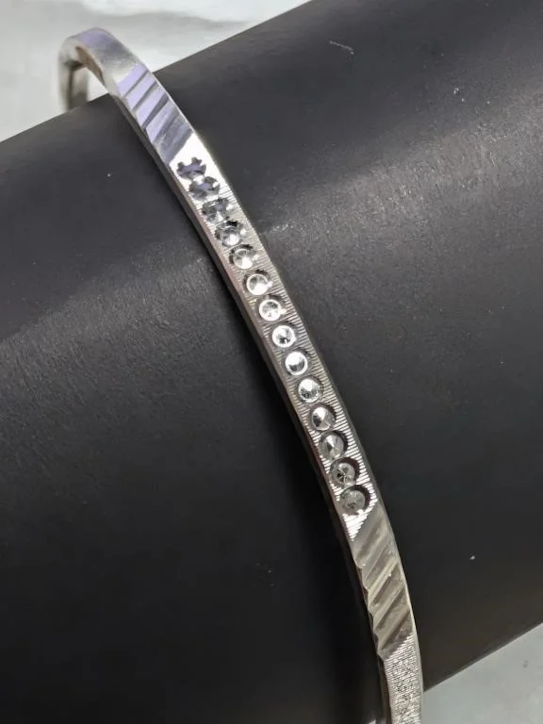 $70, silver(7.7g), bangle, retail value $70