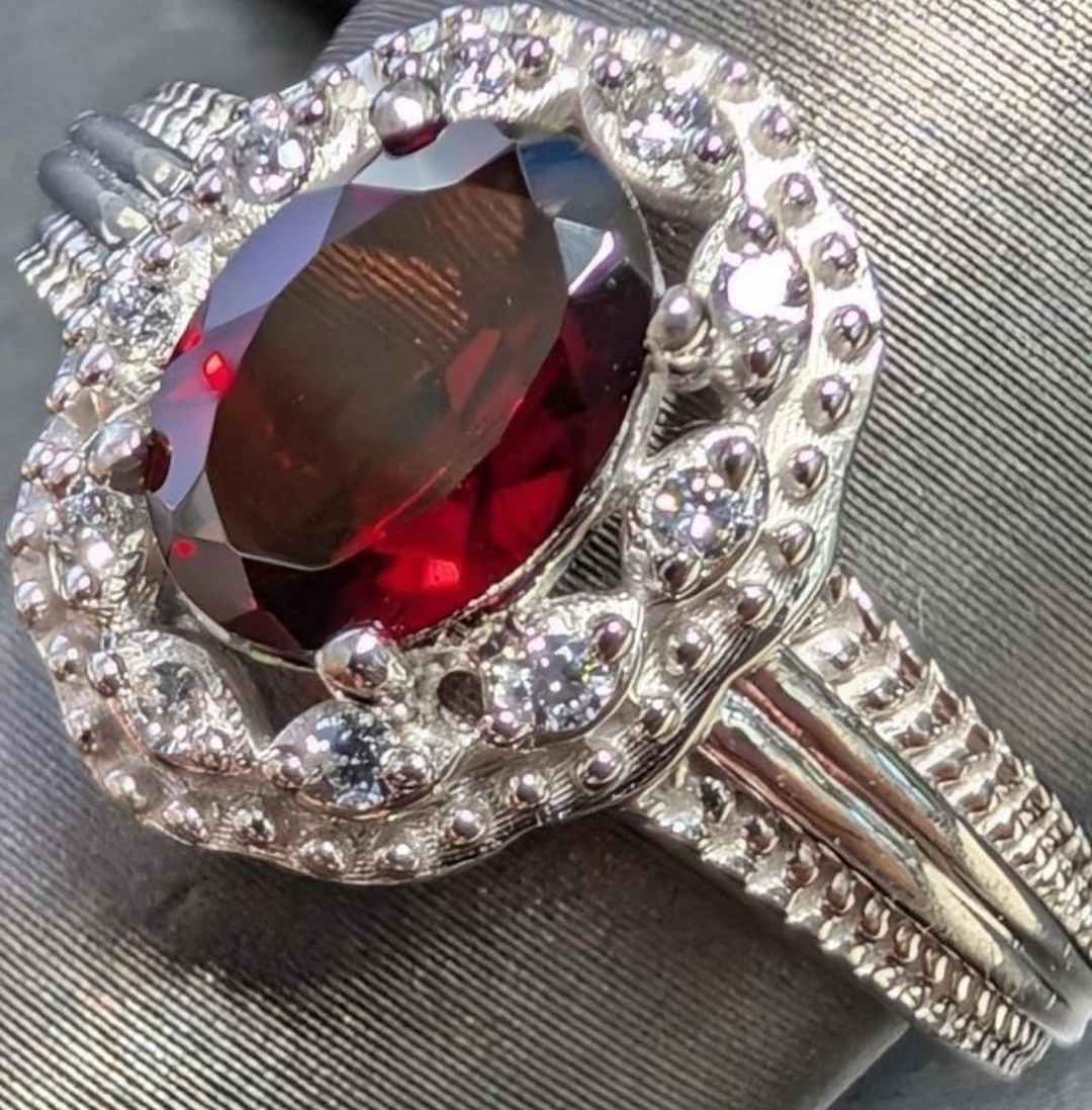 $300, silver(3.6g), garnet cz (1.5ct)ring, size 7