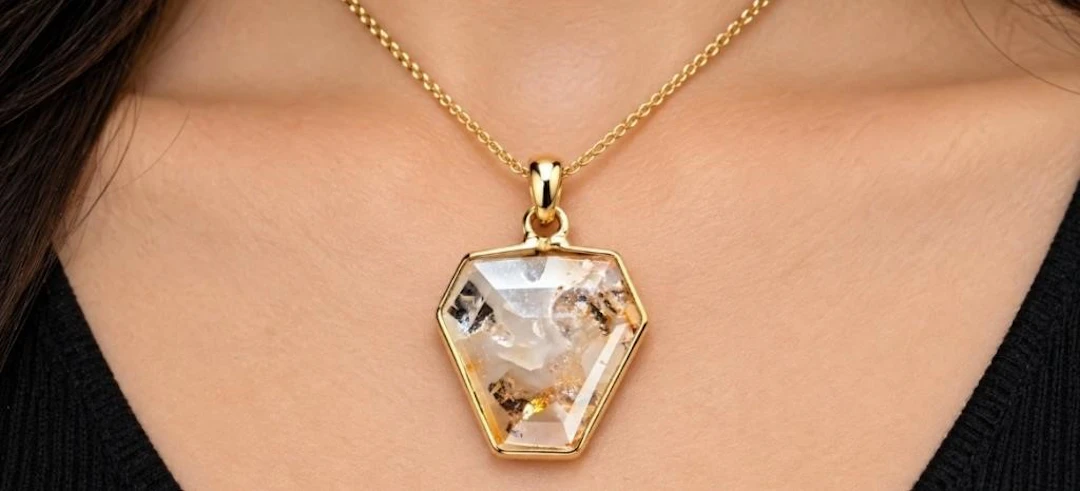 10k(0.4g), diamond (1.4ct)pendant, retail value $0