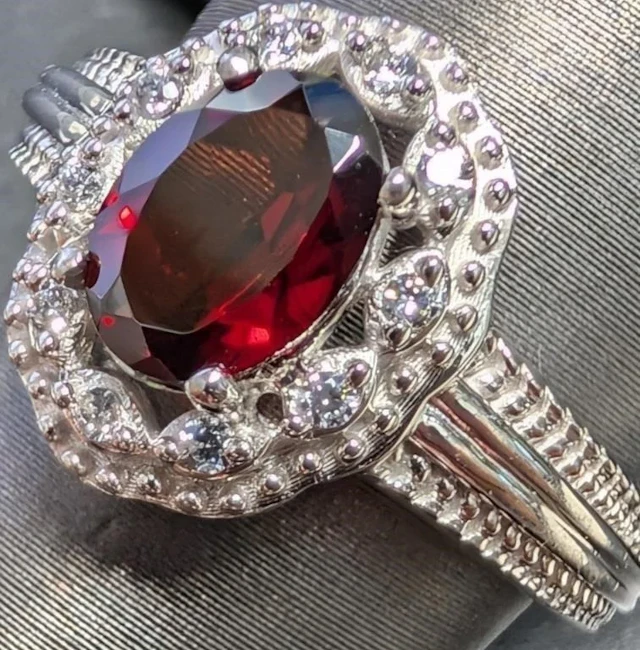 $300, silver(3.6g), garnet cz (1.5ct)ring, size 7