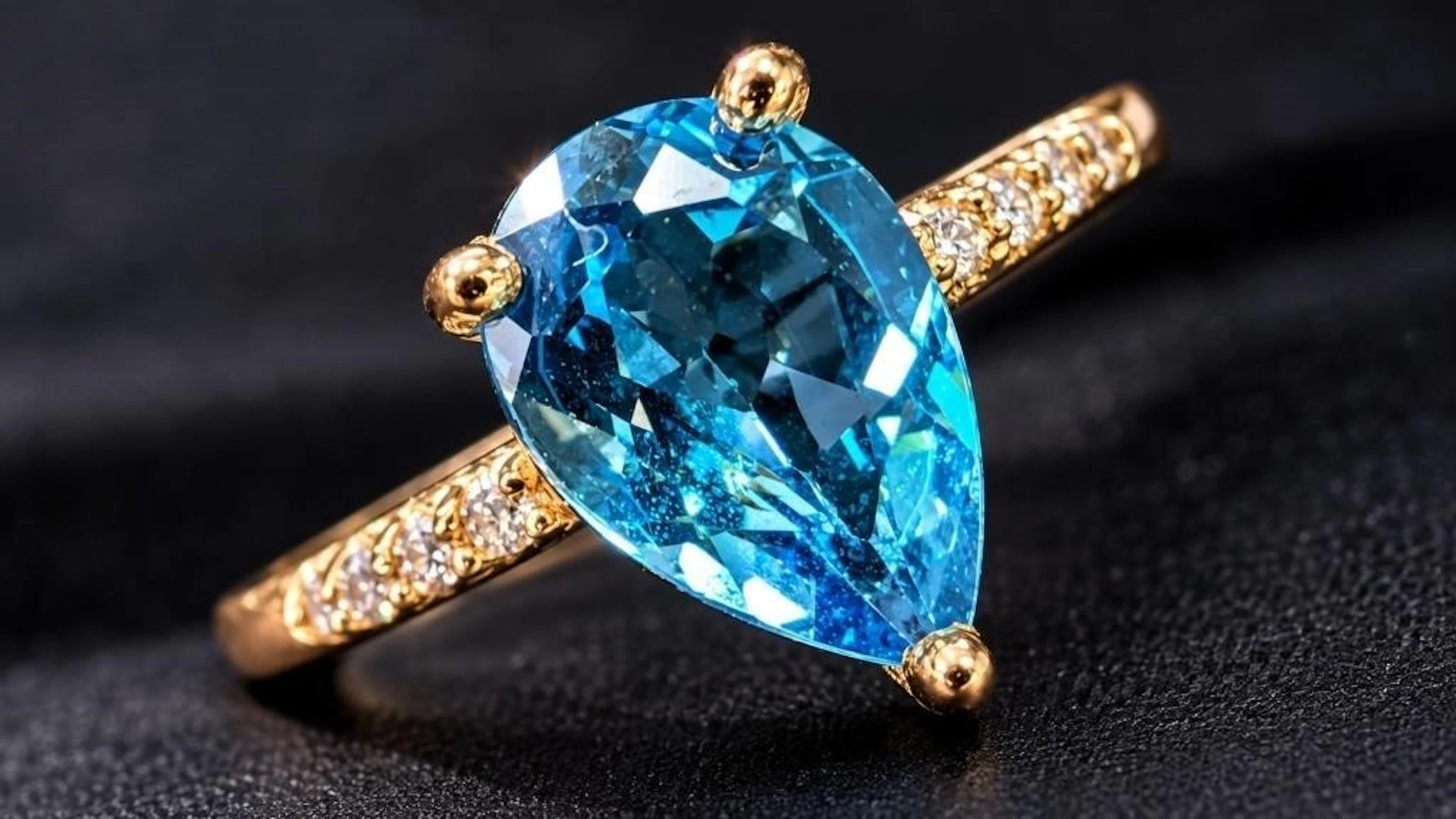 $2200, 10K(1.4g), blue topaz (1.2ct), diamond (0.0