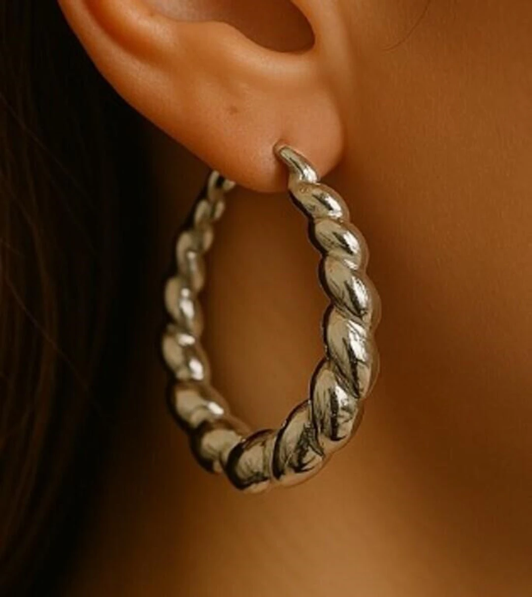 $100, silver(6.75g), earing, retail value $100