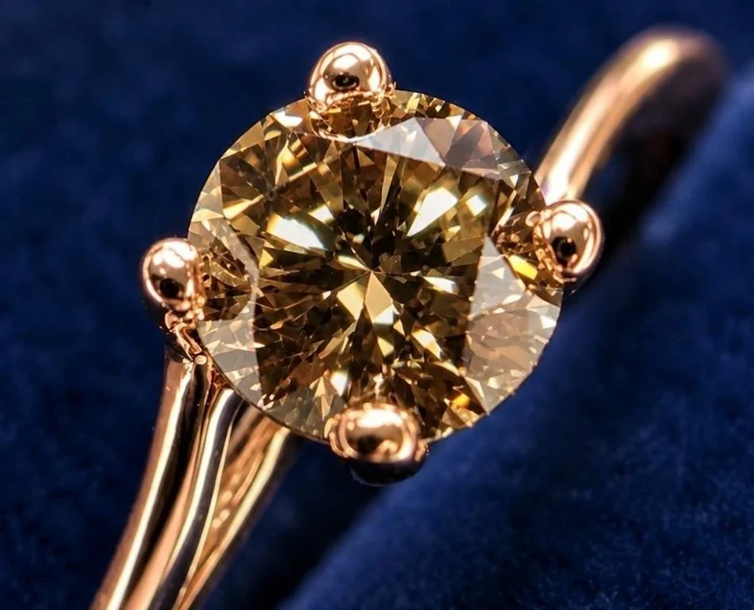 $1575, 10k(1.08g), natural brown diamond (0.32ct