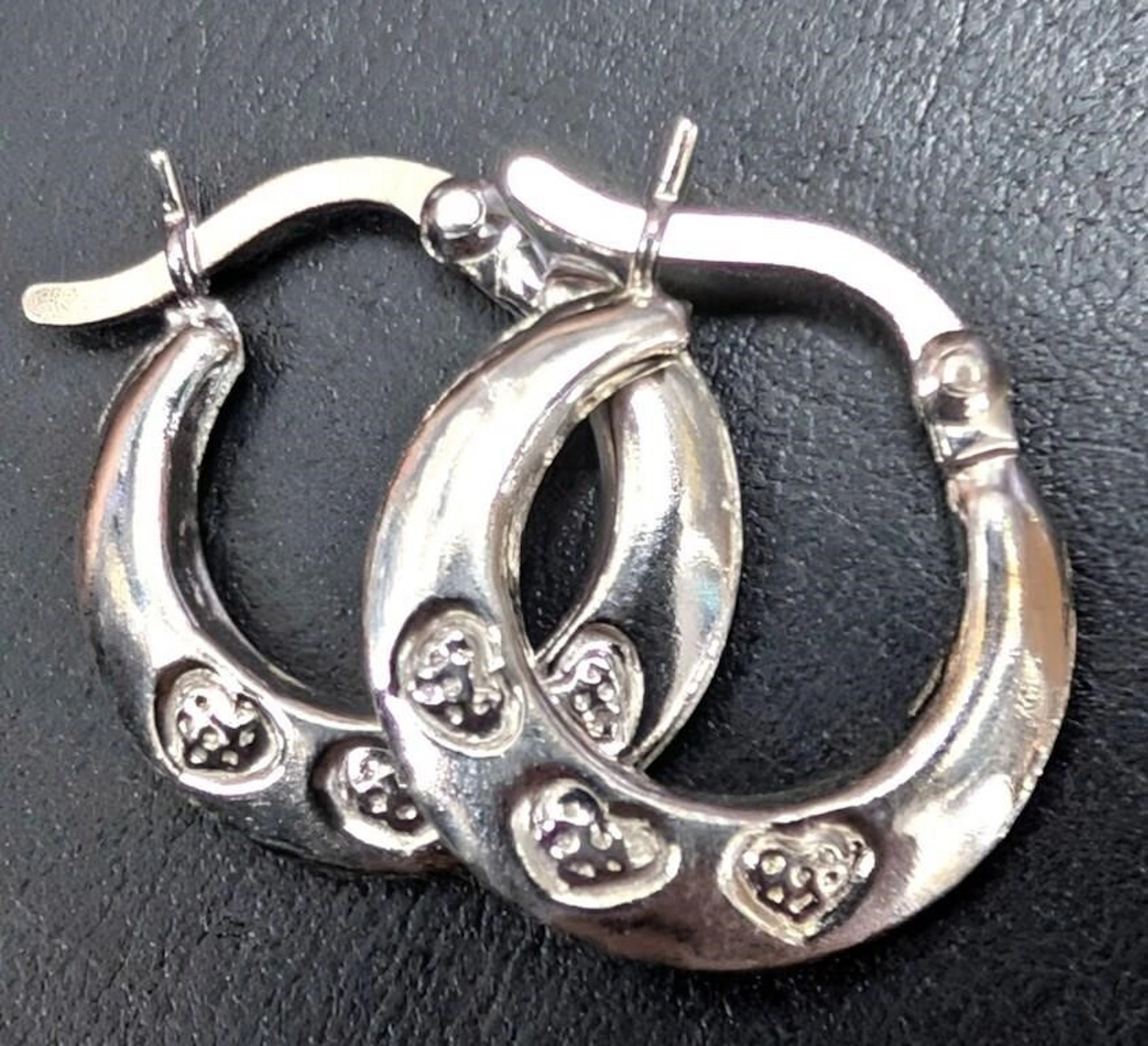 $50, silver(1.32g), small hoop earring, retail va