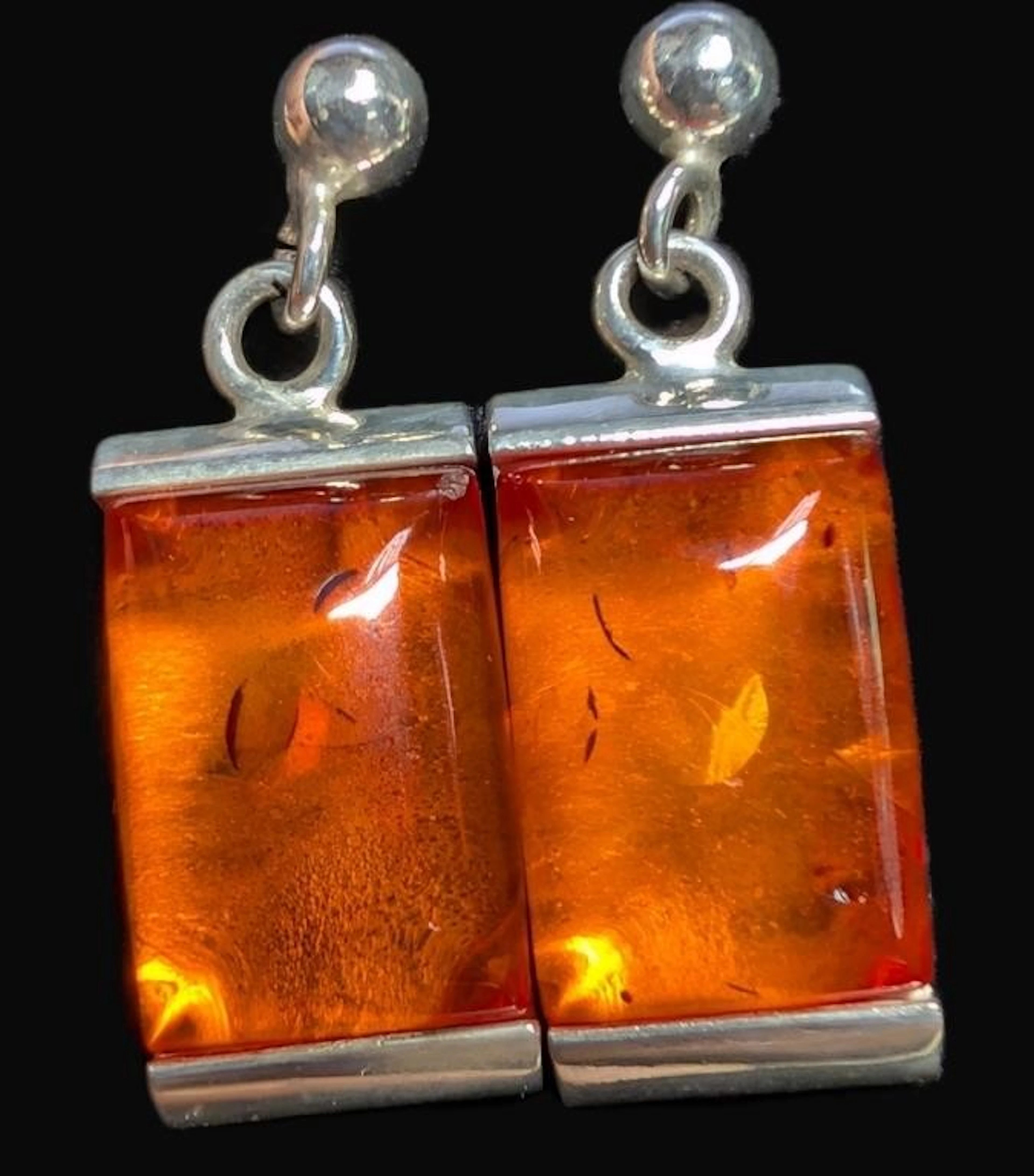 $260, silver(5.33g), amber earring, retail value