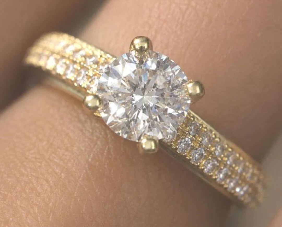 $3600, 10K (2.2g), 0.55ct lab diamond + CZ ring