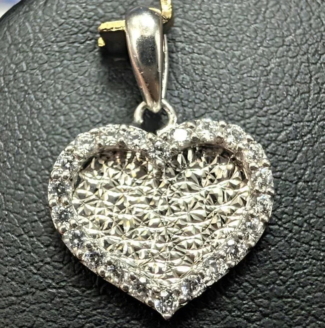 $1150, 10k(1.54g), cz pendant, retail value $1150