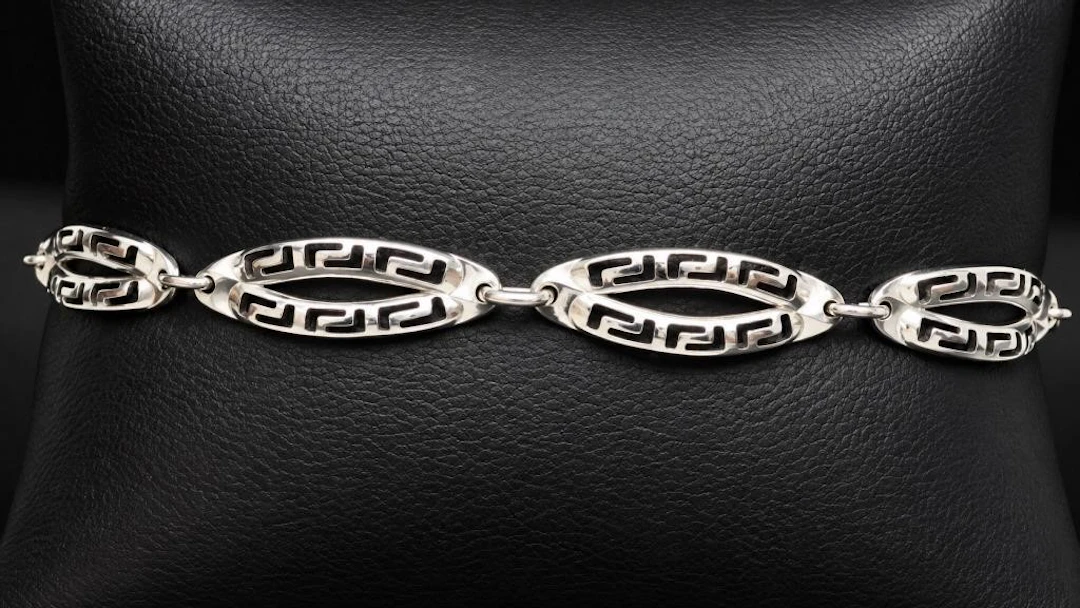 $1550, 10k(2.25g), bracelet 7", retail value $155