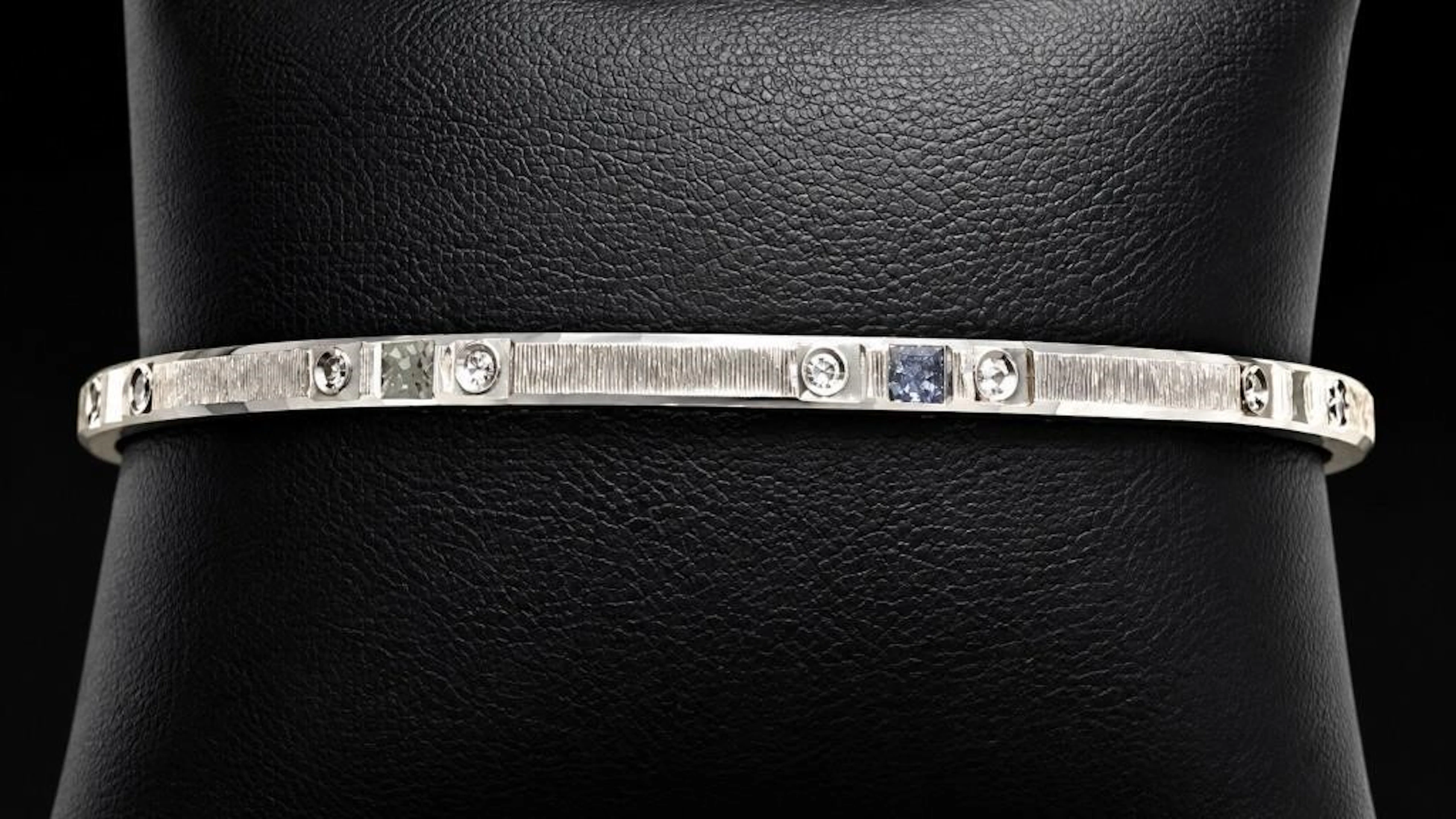 $400, silver(14.2g), bangle, retail value $400