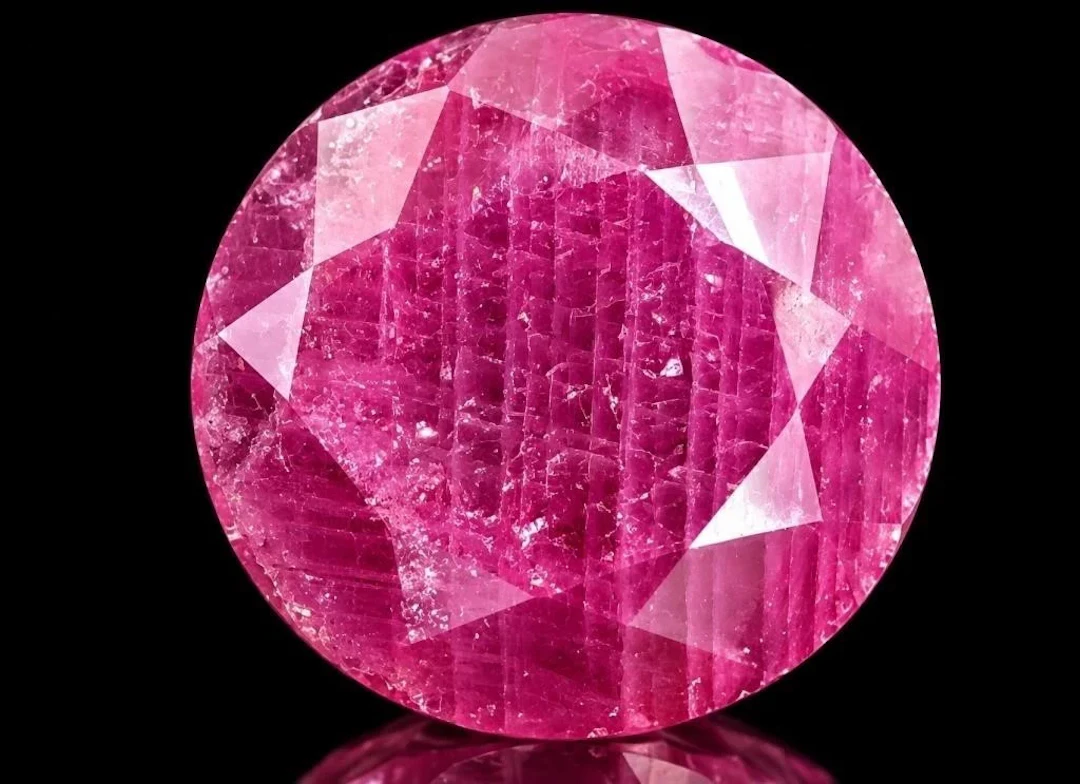 $100, genuine ruby enhanced (5.5ct), retail value
