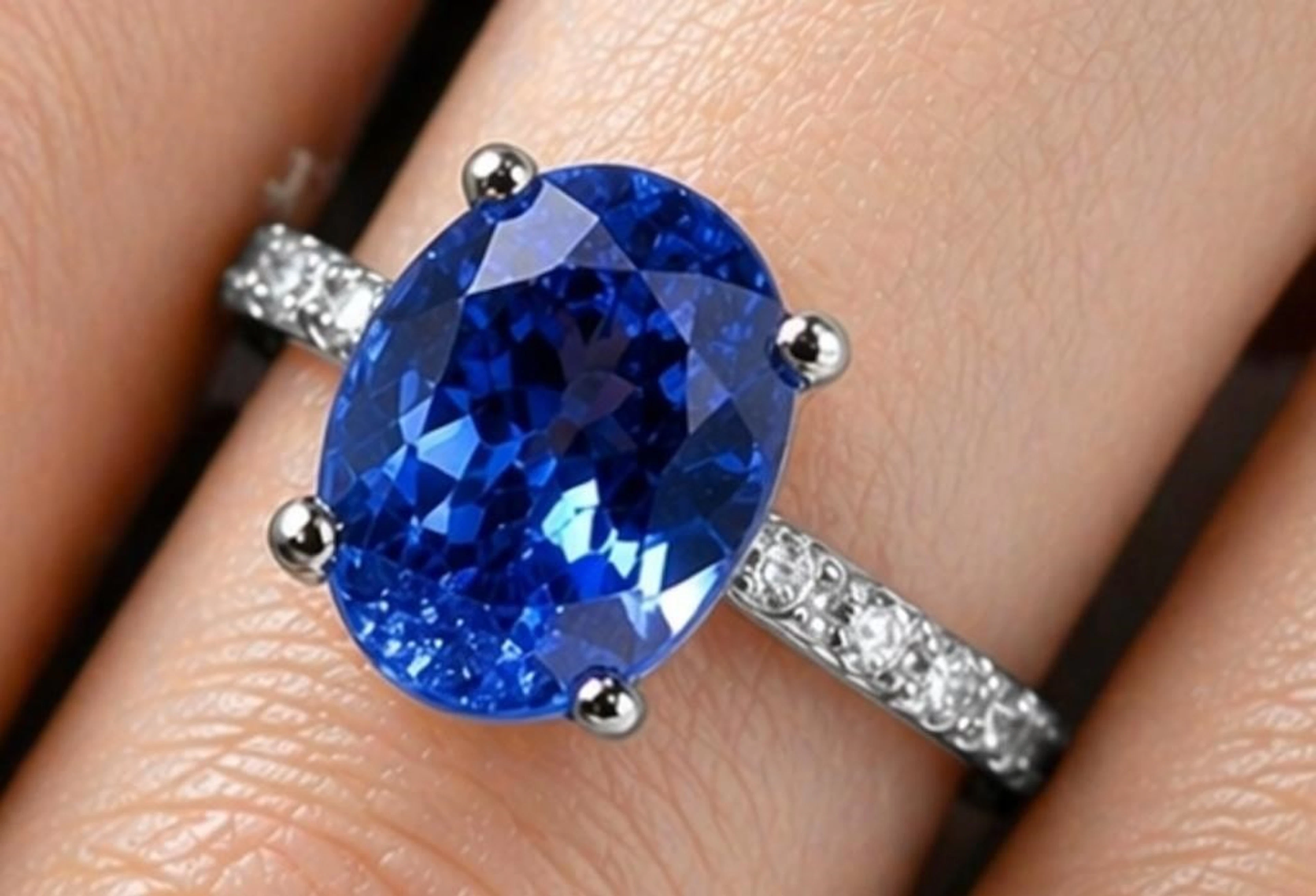 $4000, pt950(2.88g), tanzanite (0.6ct)ring, size 5