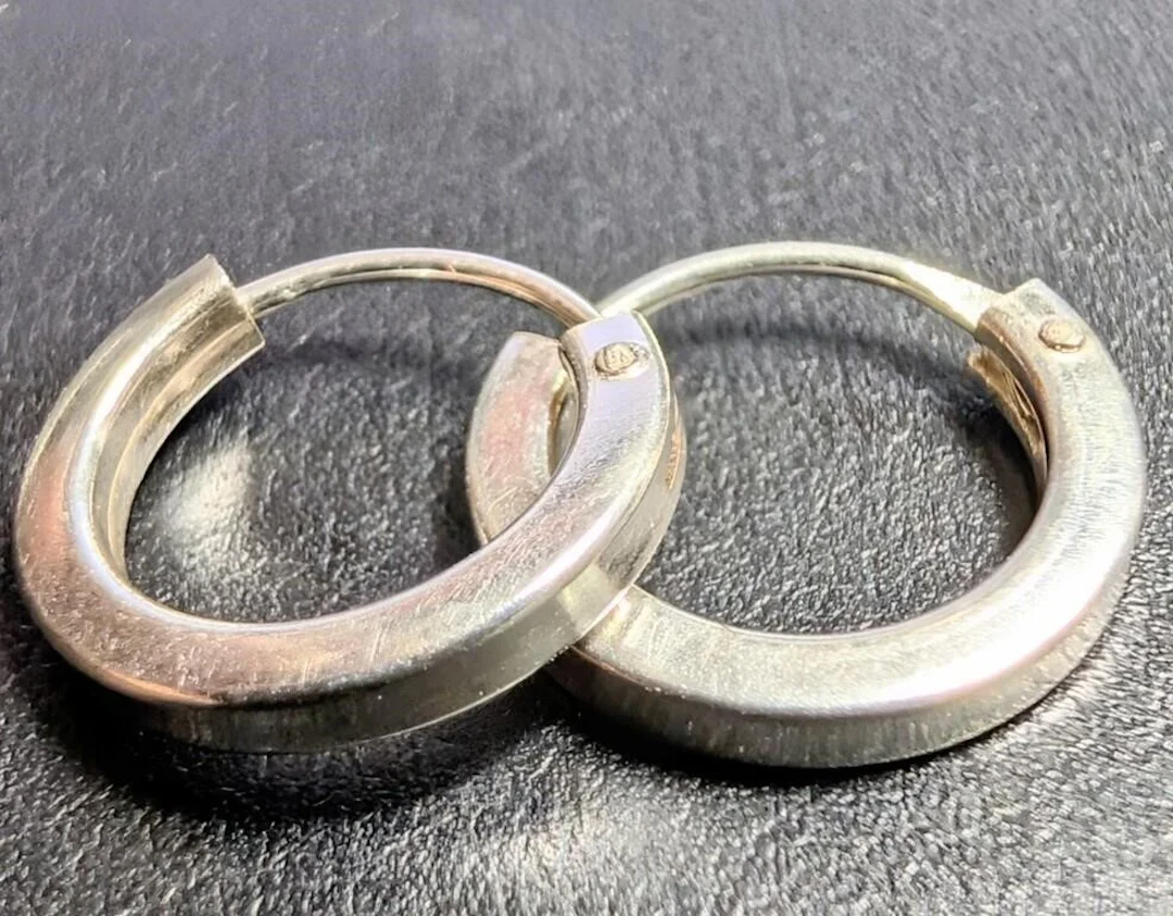 $50, silver earring, retail value $50