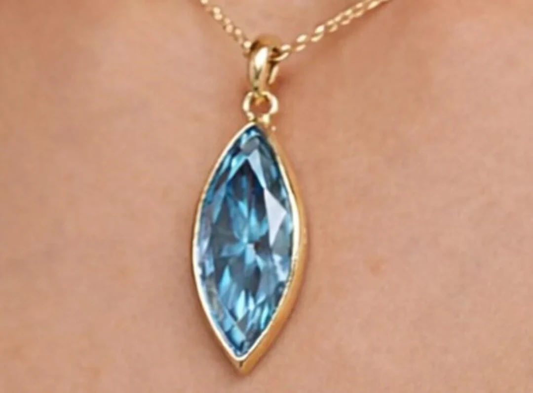 $1200, 10kblue topaz (0.65ct)pendant, retail value