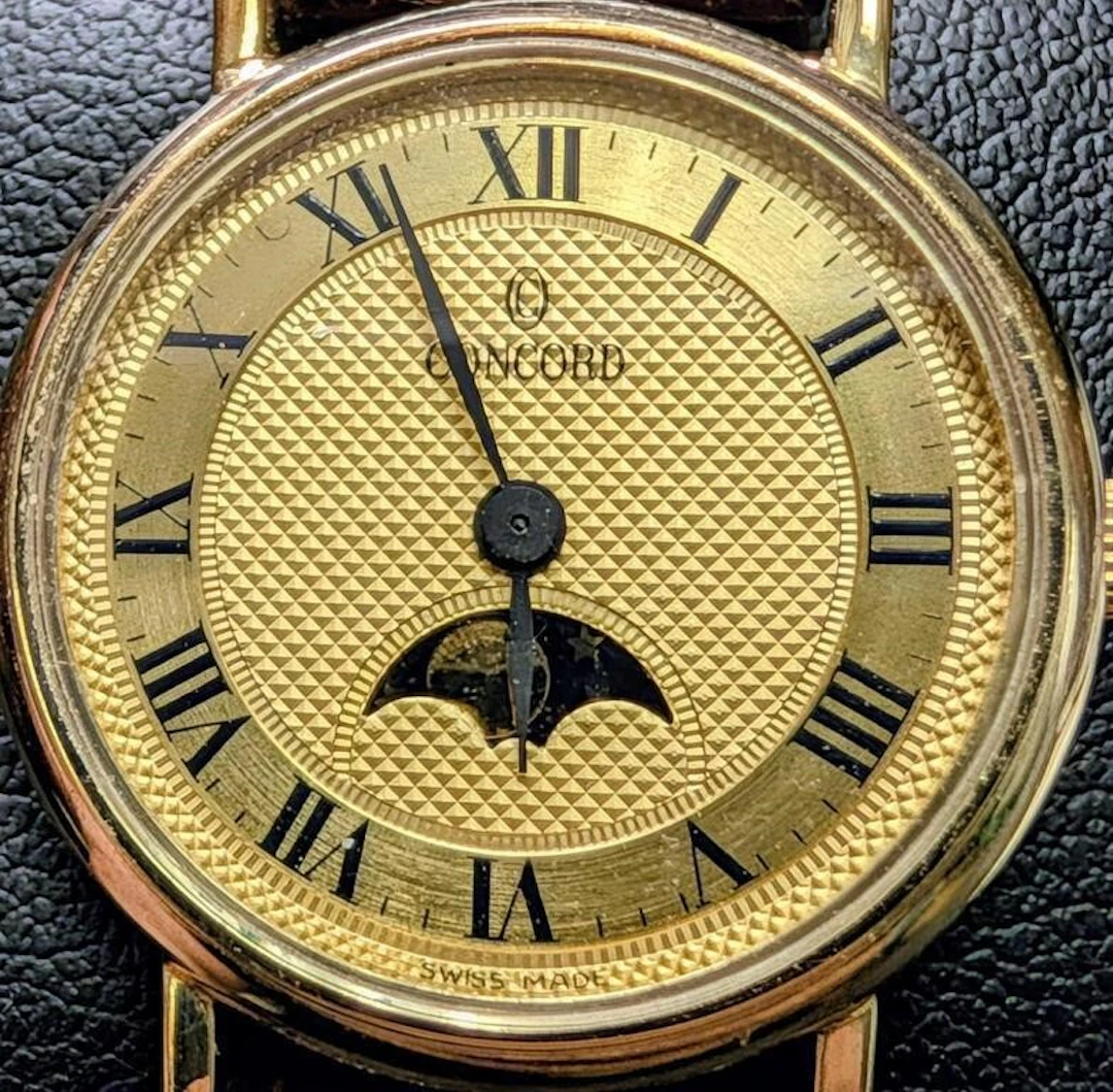 $2560, Concord 14K (13g with strap) Moonphase Dres