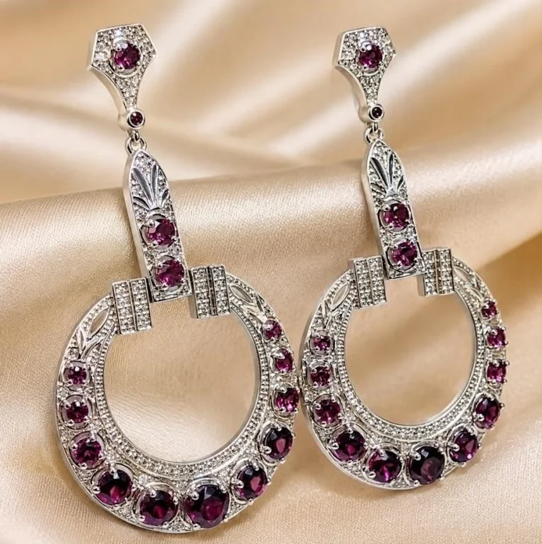 $1000, silver(18g), garnet (app 4ct) earring, ret