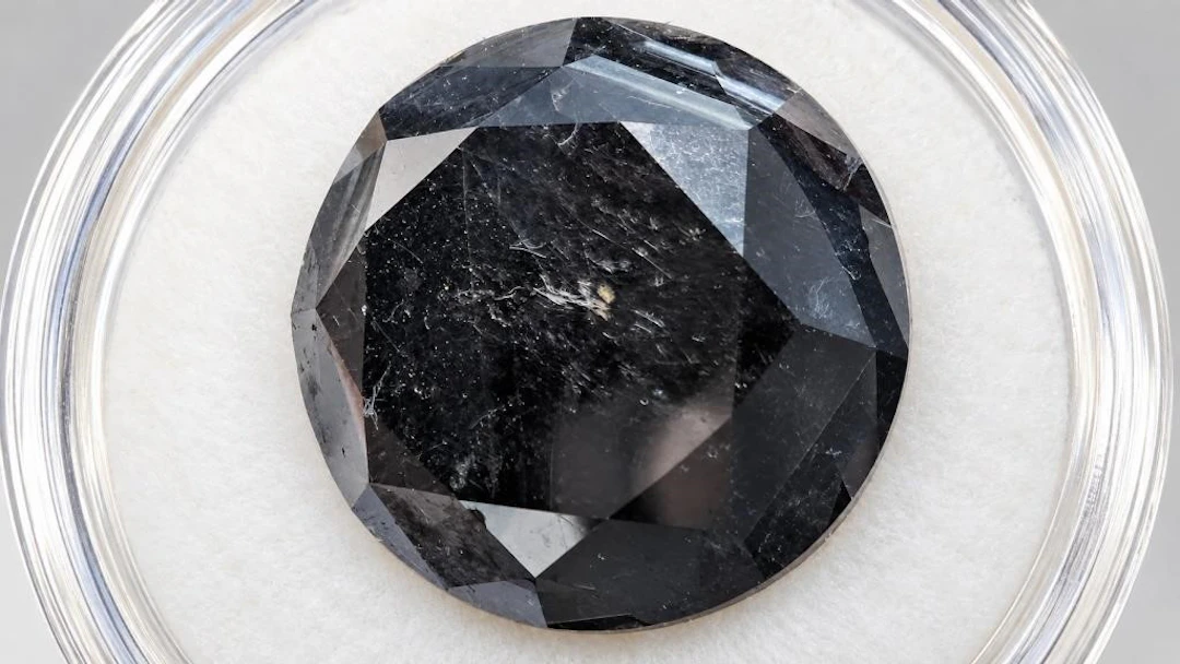 $9000, black diamond (18.23ct)gemstone, retail val