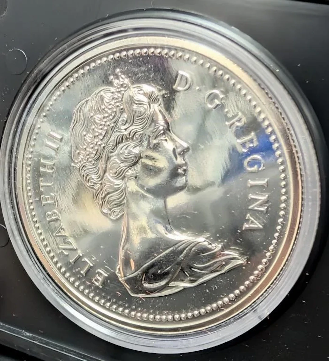 ., Silver (23.3g) proof dollar coin, retail value