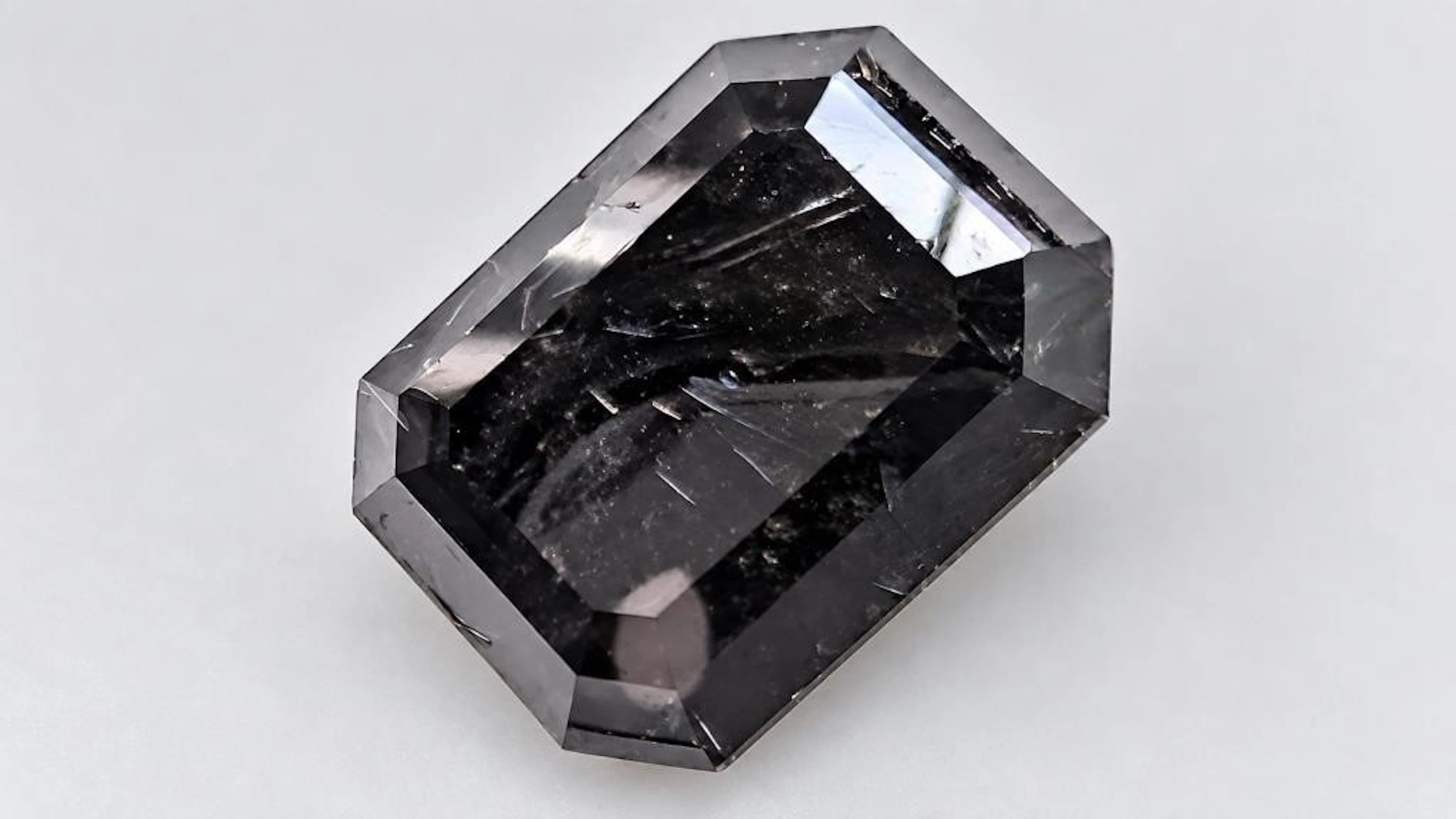 $4000, black diamond (10.8ct)gemstone, retail valu