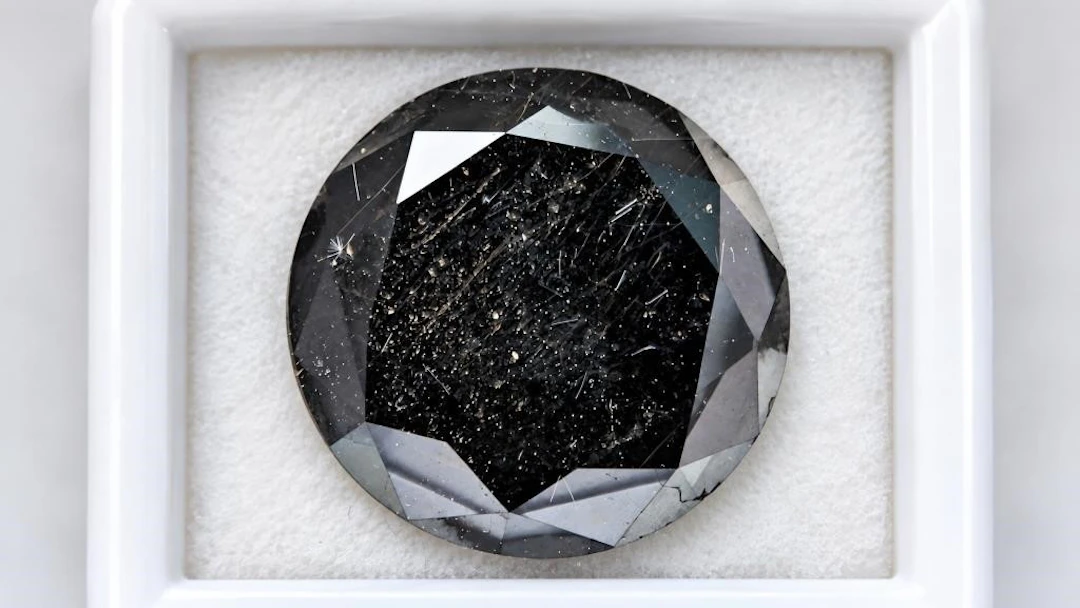 $2400, black diamond (5.9ct)gemstone, retail value