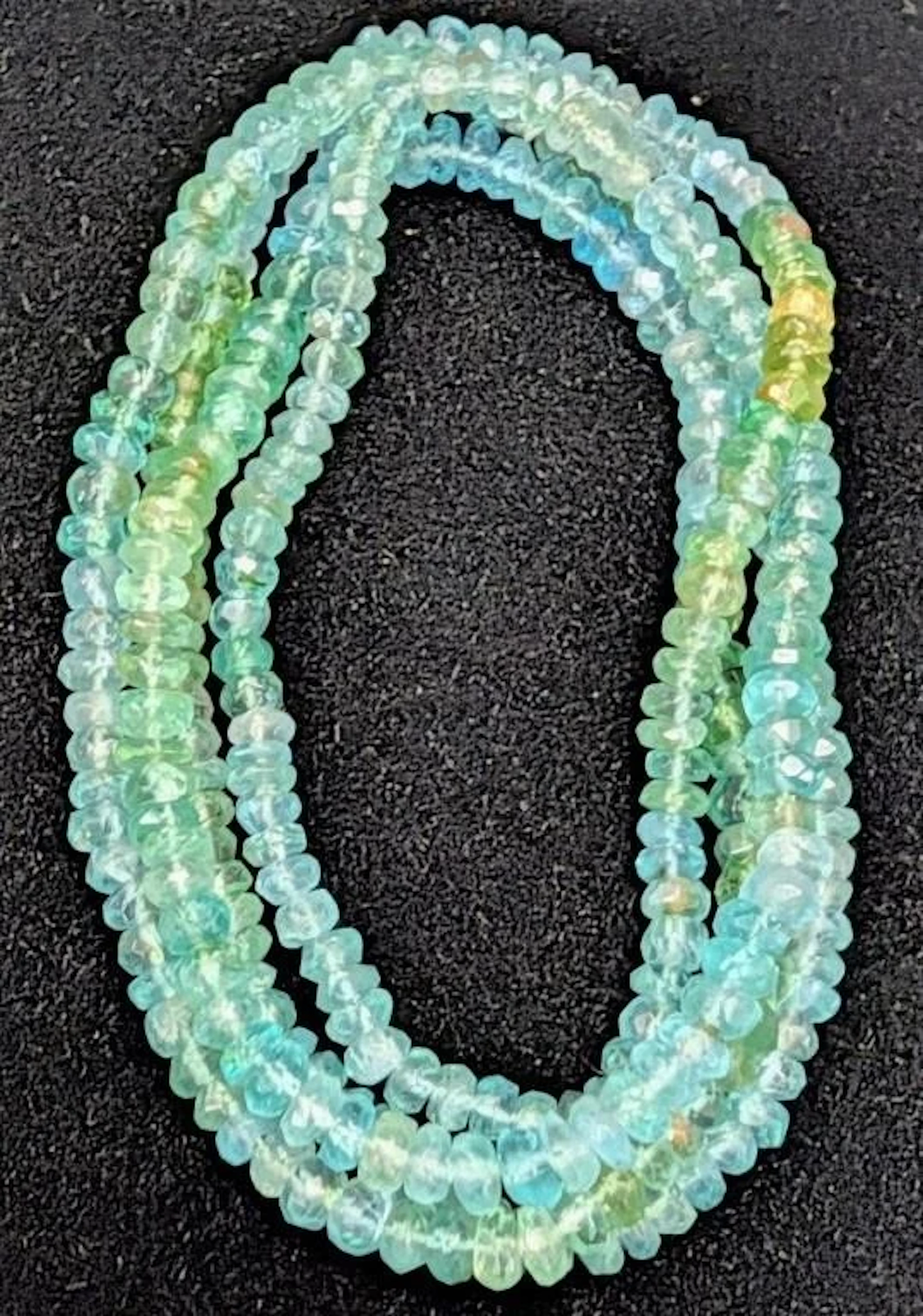 $500, apatite facted beads (app 95ct) chain 28"