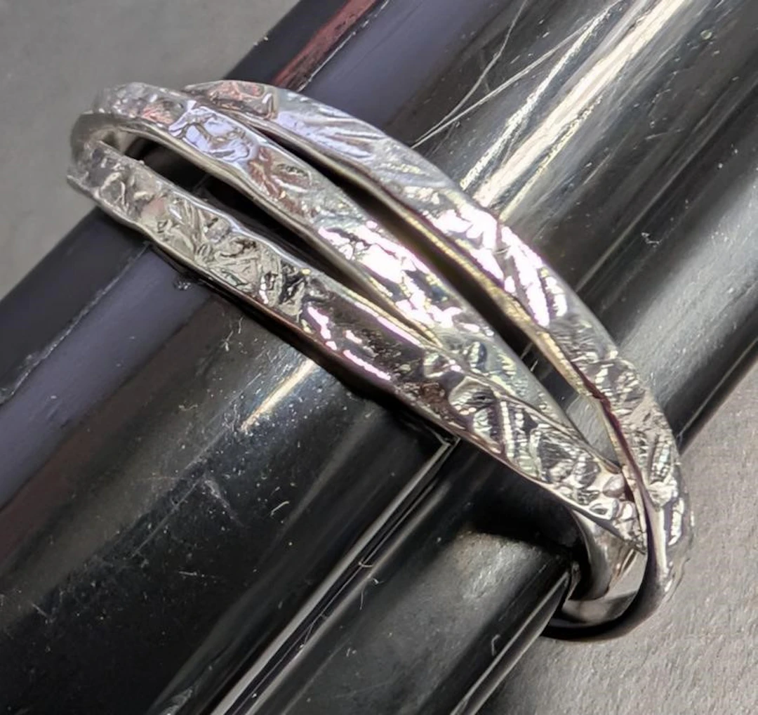 $50, silver (1.5g), three ring, size 6, retail val